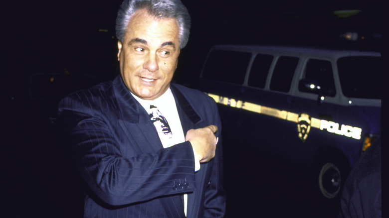 John Gotti near police vehicle