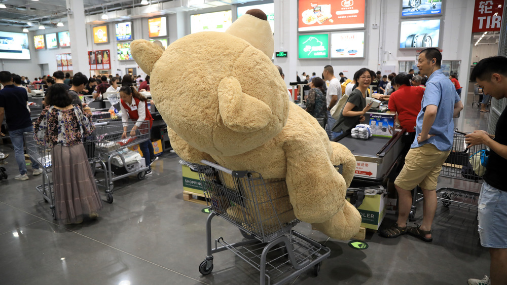 Large teddy bear loaded into Costco cart