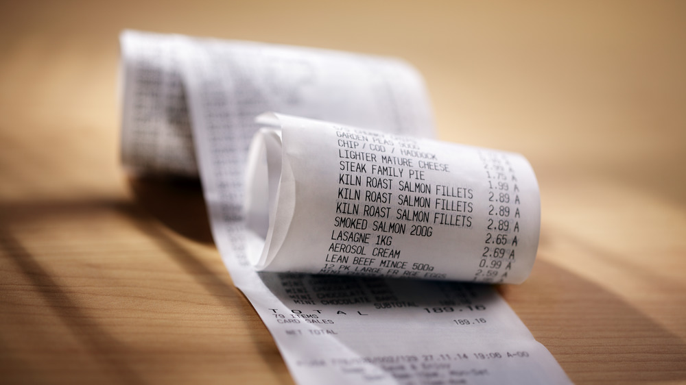 Receipts on wood surface