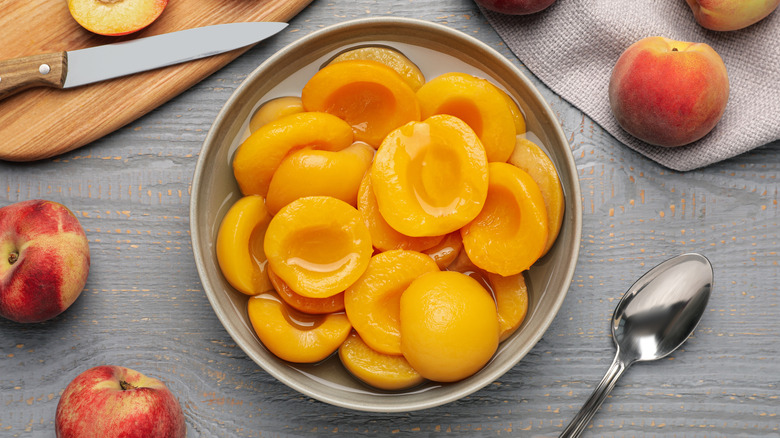 canned peaches in a bowl