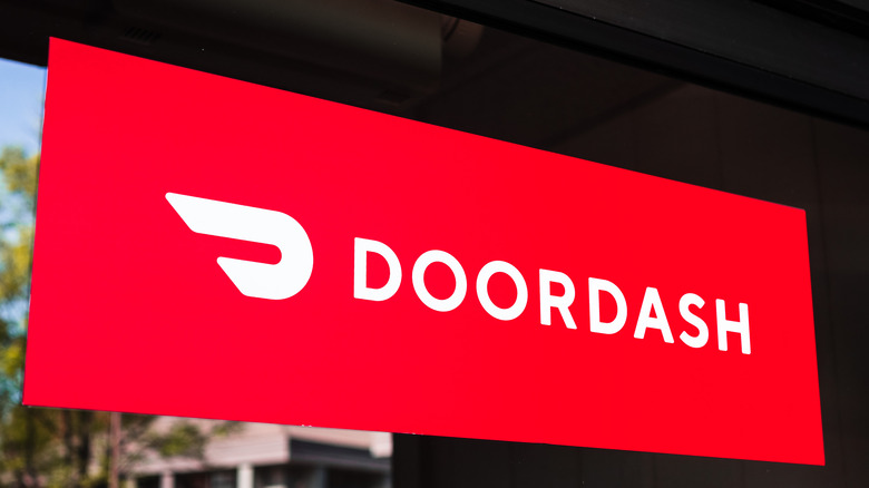 DoorDash logo on a window