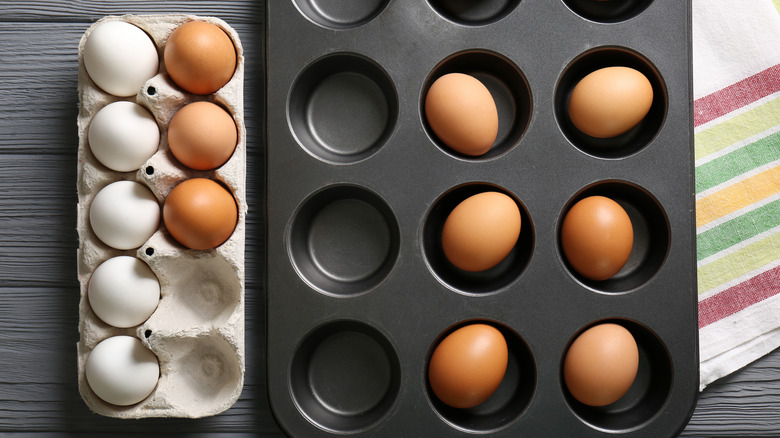 Raw eggs in a muffin tin