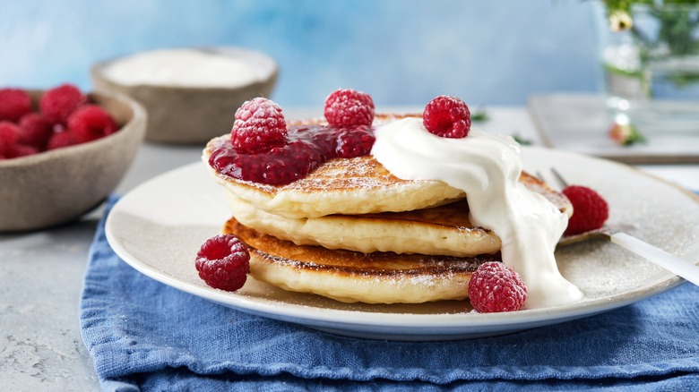 pancakes topped with raspberries