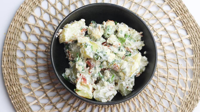 Creamy potato salad with chopped scallions