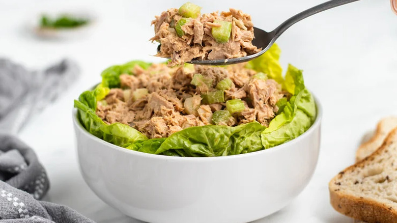 Bowl with tuna salad nestled in lettuce leaves