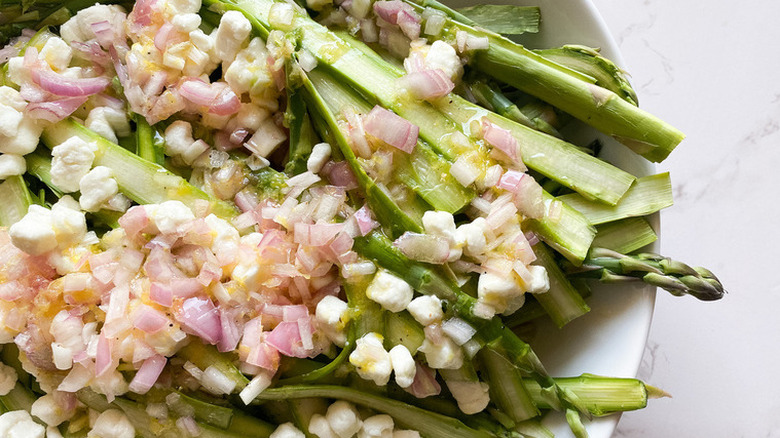 Asparagus strips with dice onion and feta cheese.