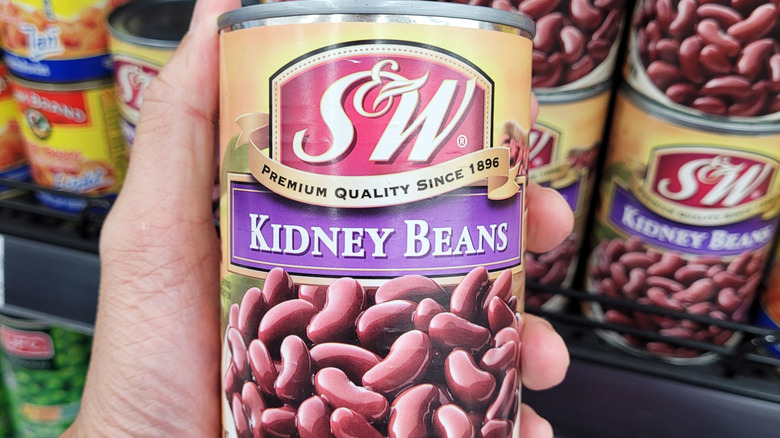 Handheld can of kidney beans in store