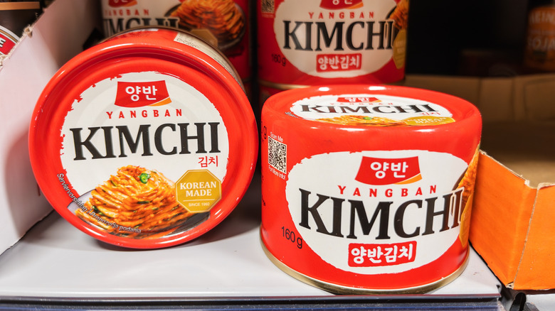 Cans of kimchi on a shelf