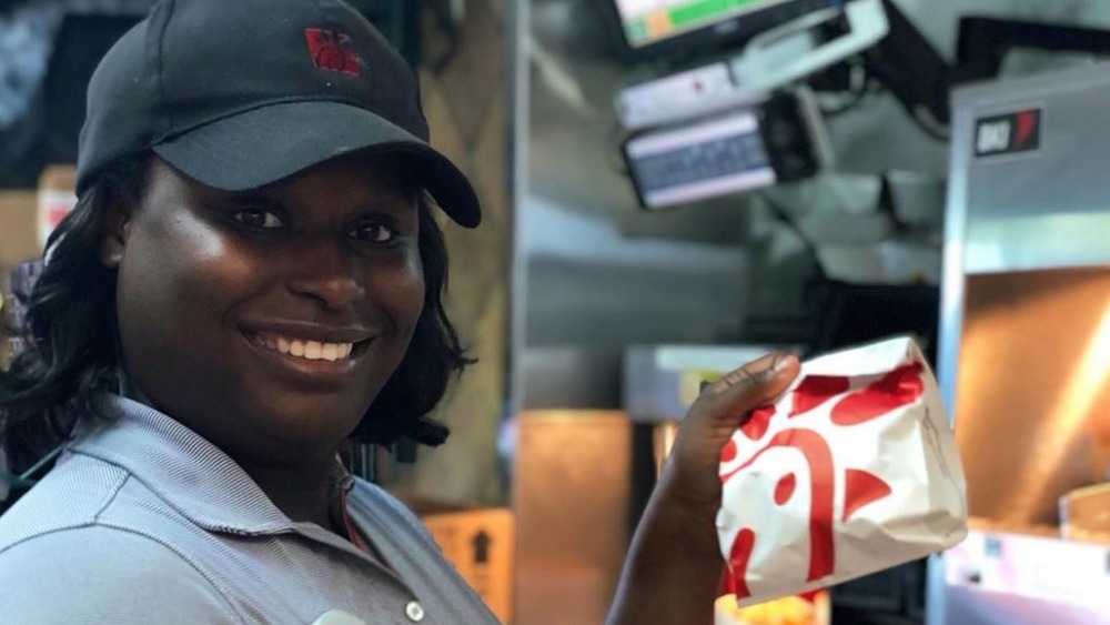 Smiling Chick-fil-A employee in kitchen