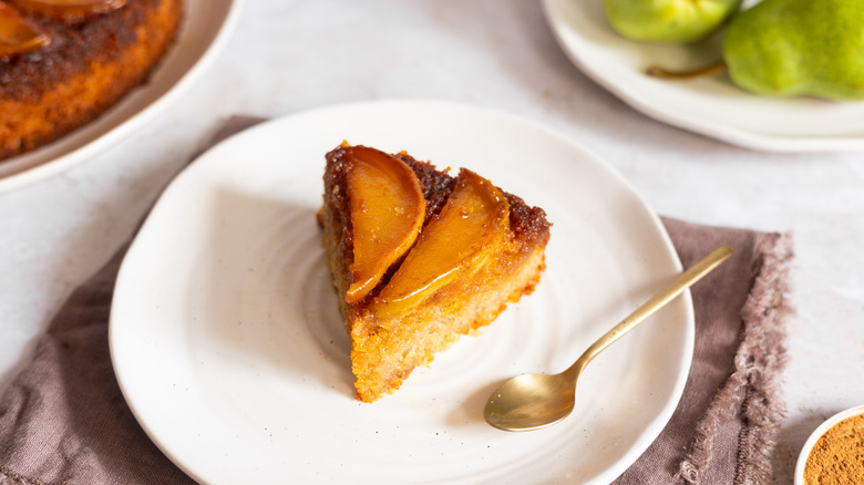 upside down pear cake slice on plate 