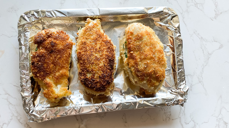 chicken Kiev on baking sheet