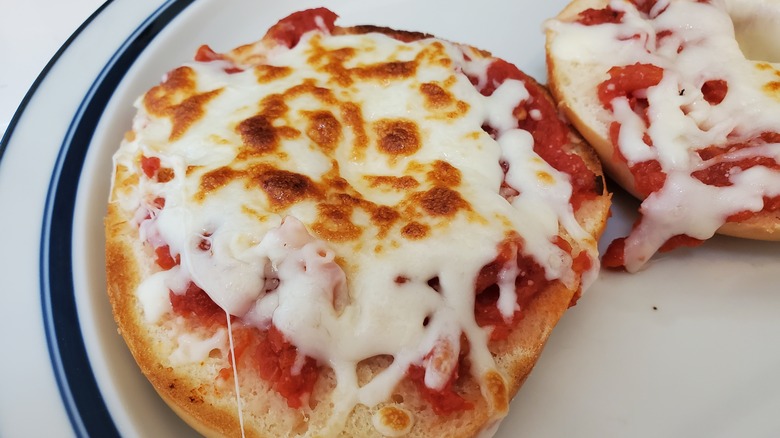 cheesy pizza bagel on plate