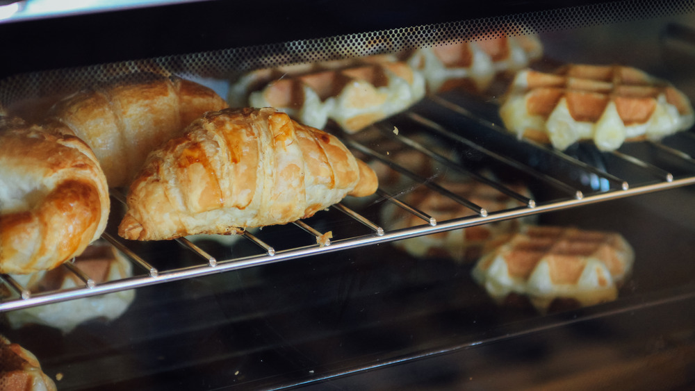 Croissants and waffles in an oven