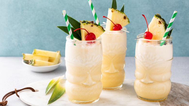 Tropical cocktails with straws