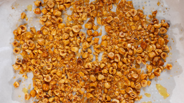 baked caramelized hazelnuts on tray 