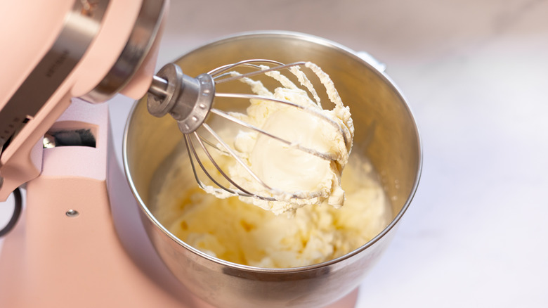 whisked cream in bowl 