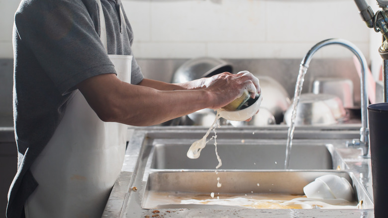 Person washing a bowl