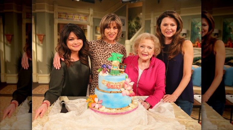 Hot in Cleveland cast with birthday cake for Betty White