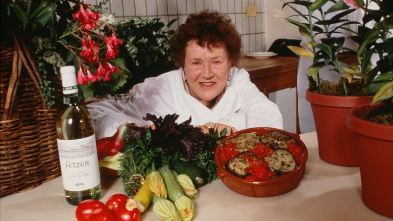 Julia Child with veggies and bottle of wine