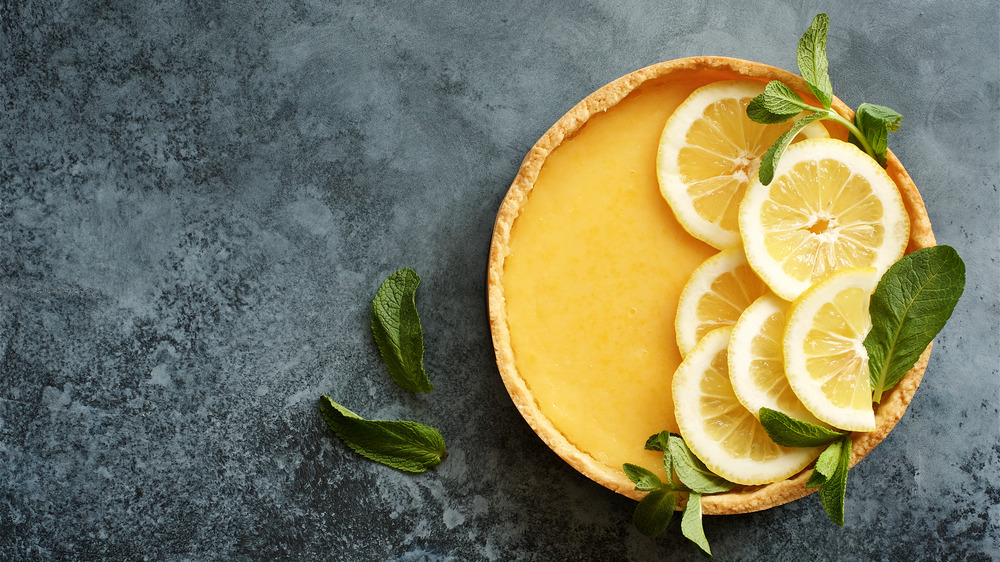 Lemon tart on gray background