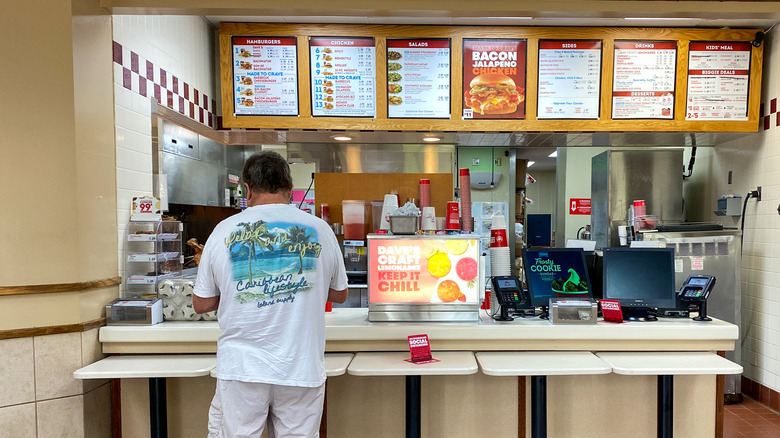 man ordering at Wendy's