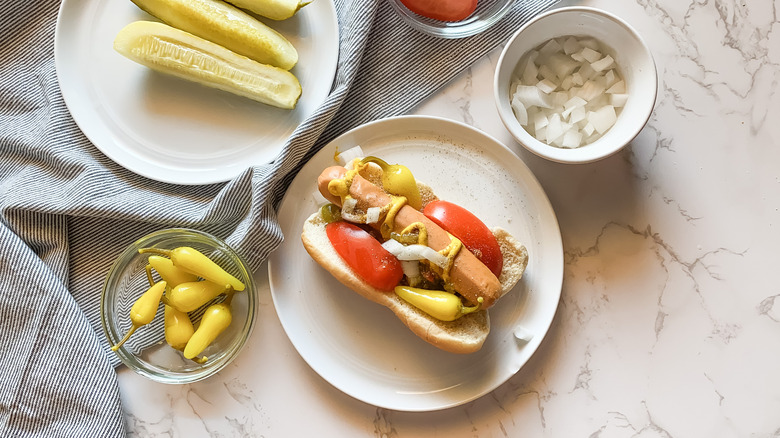 assembling Chicago-style hot dog