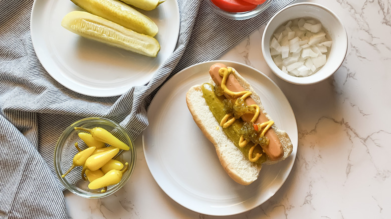 assembling Chicago-style hot dog