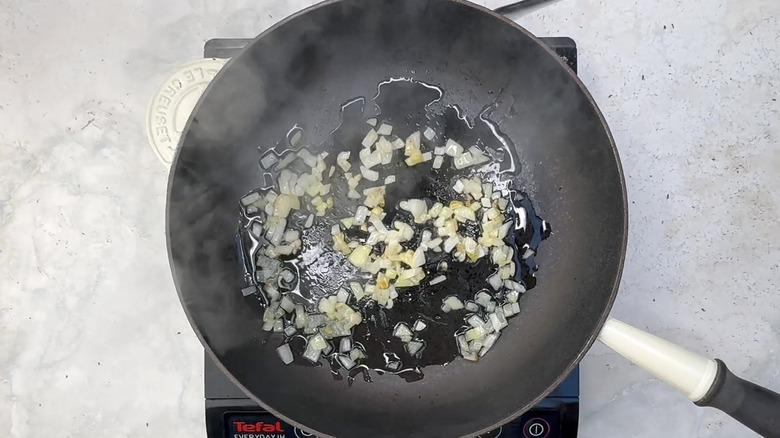 Onion frying in pan