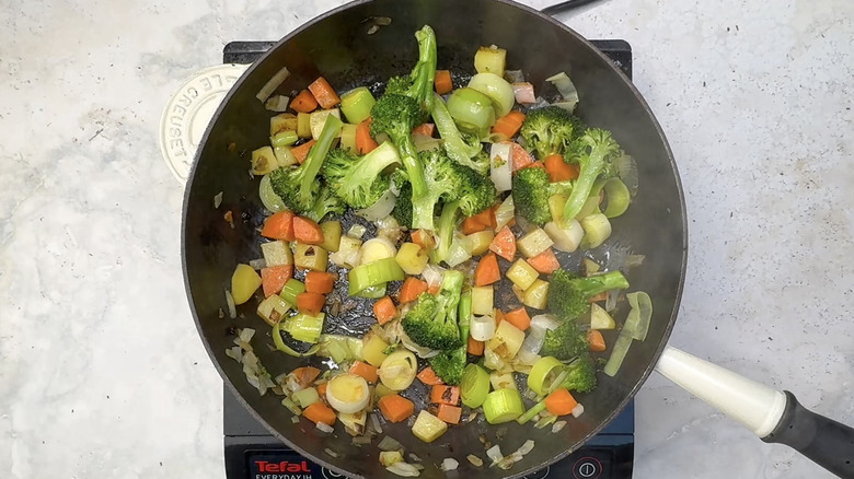 leek, carrot, potato, and broccoli in pan