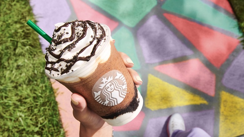 Starbucks chocolate frappuccino over a chalk-colored path