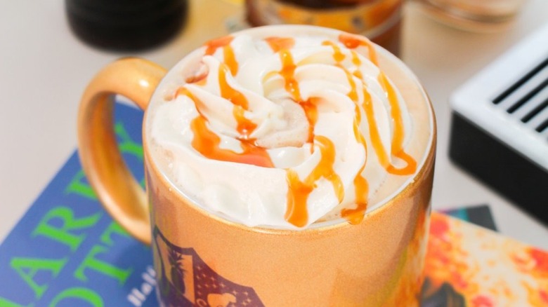 Close up of a hot caramel latte in a mug