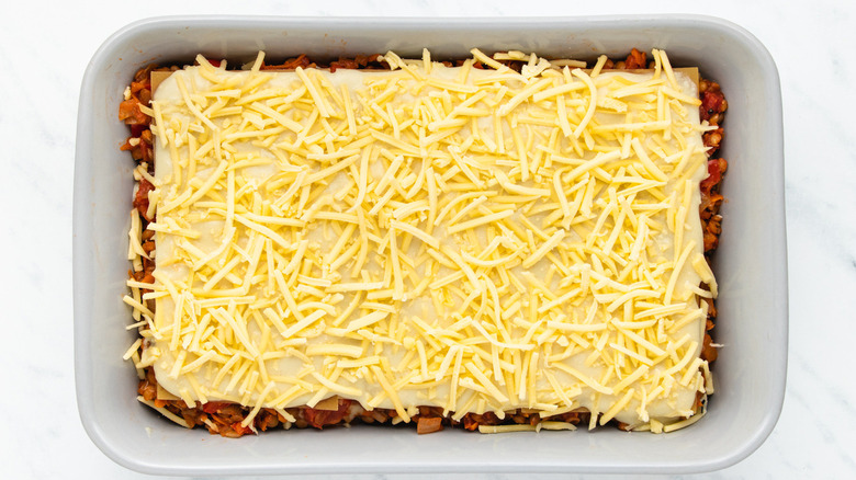 unbaked lasagna in baking dish