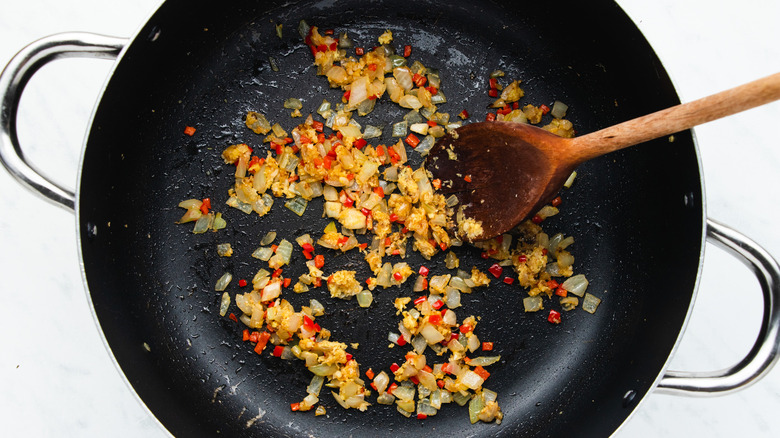 onions and spices in pan 