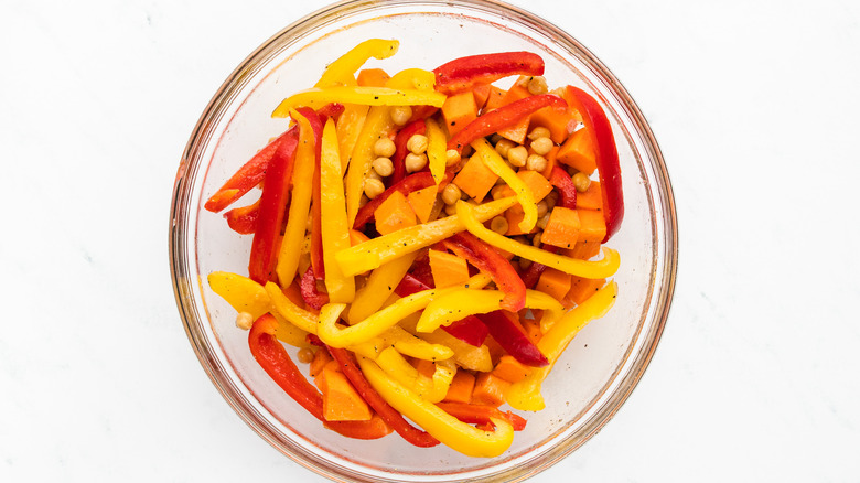 chickpeas and vegetables in mixing bowl