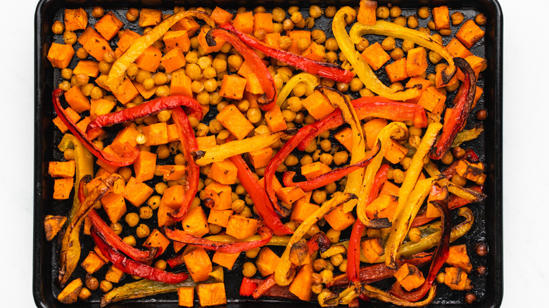 roasted veg and chickpeas on baking sheet