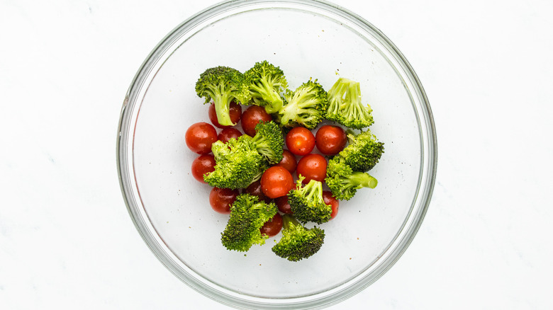 broccoli and cherry tomatoes in mixing bowl