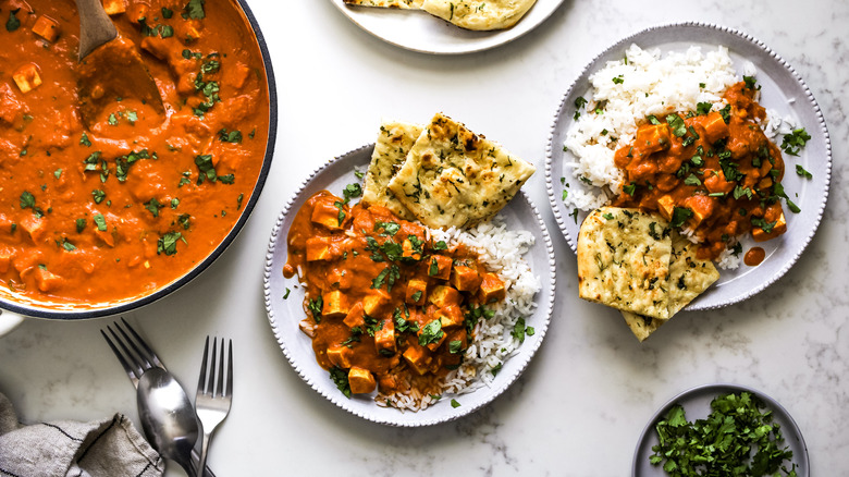 vegan tofu tikka masala served with naan and rice