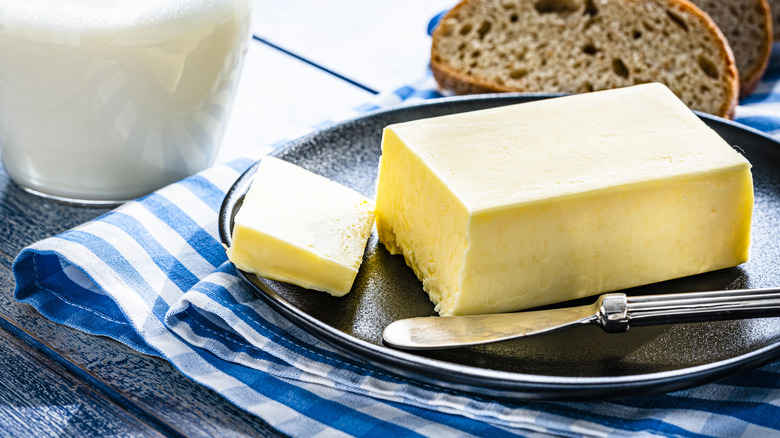 Block of butter on plate