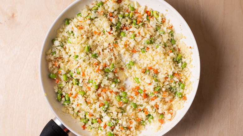 Fried cauliflower "rice" in a skillet