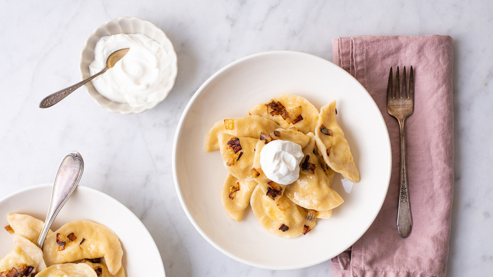 Pierogies with sour cream on the side