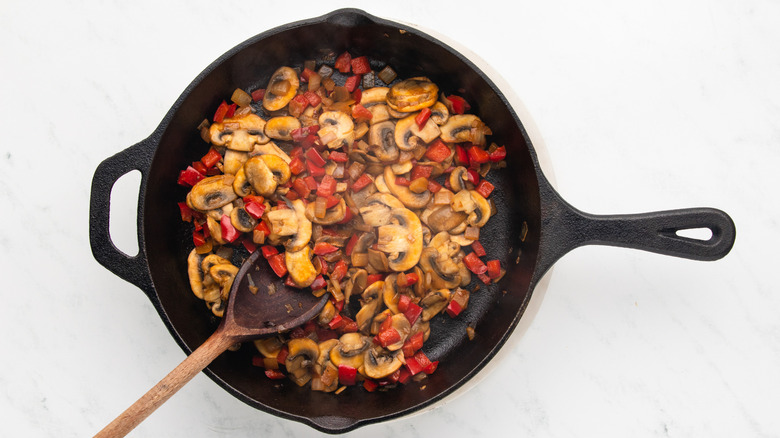 Pepper, onion, and mushroom in cast iron skillet