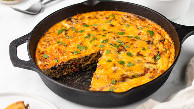 Vegetable and black bean frittata in cast iron skillet