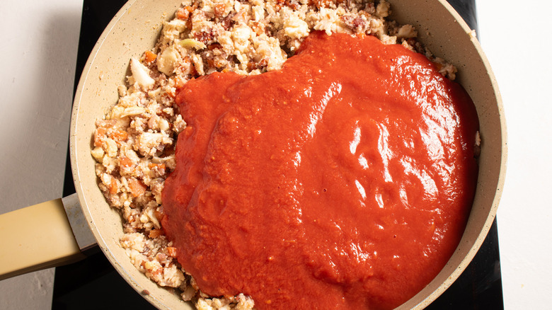 tomato sauce veggies in pan