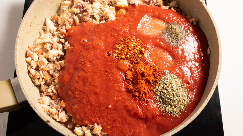 spices and sauce in pan