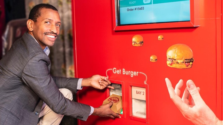 CEO Audley Wilson getting burger from machine