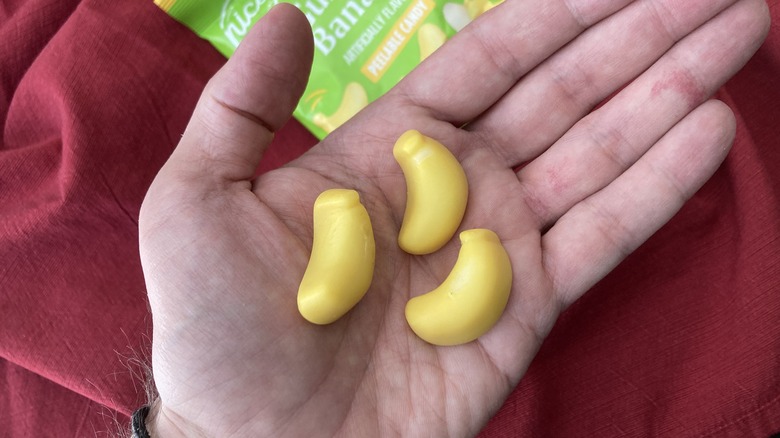 hand holding gummy bananas