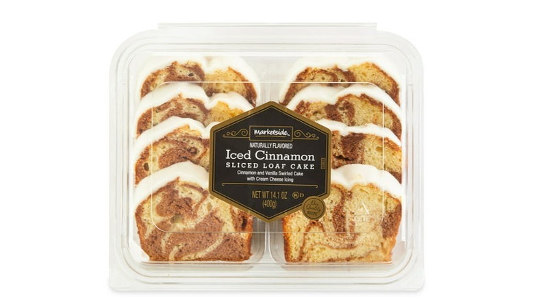 Clamshell box holding sliced cinnamon loaf cake slices