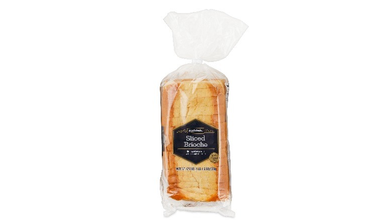 Sliced brioche loaf in plastic bread bag