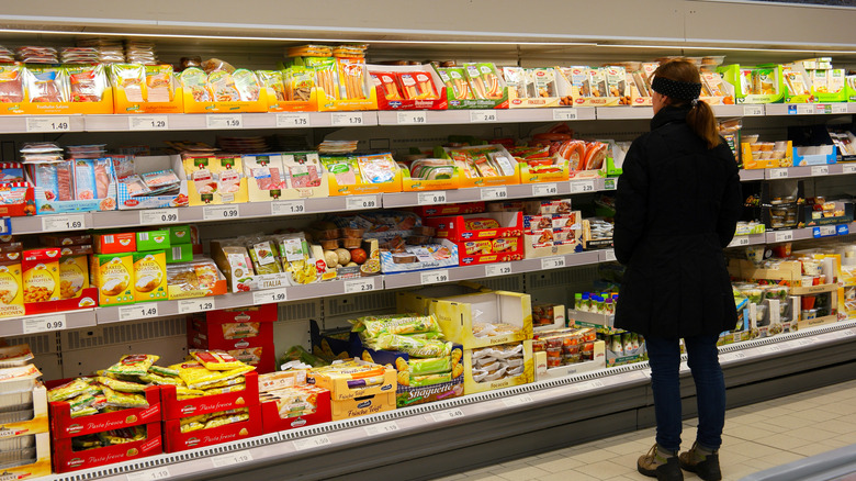 Shoppers scanning Aldi aisles