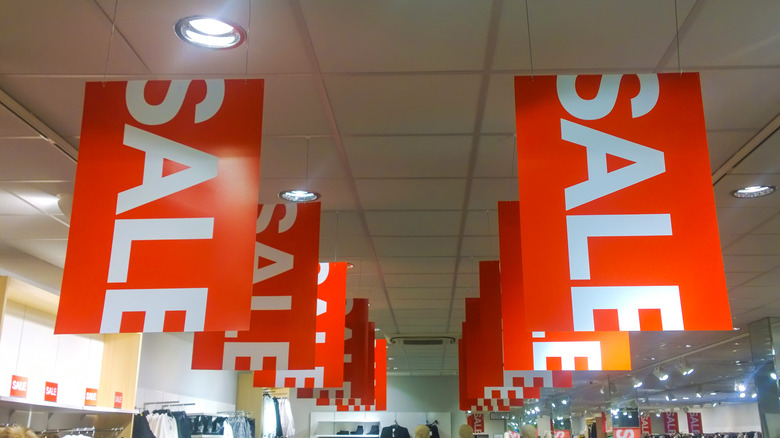 Sale signs hanging from ceiling